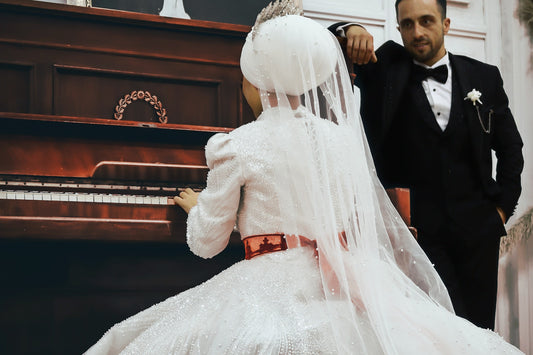 bride and groom by the piano